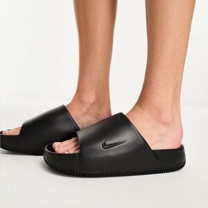 Nike Calm sliders in black Size W6